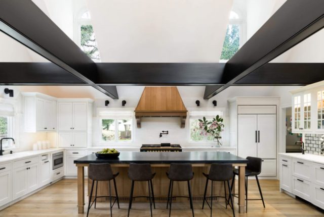 Island with a dark counter top in a kitchen